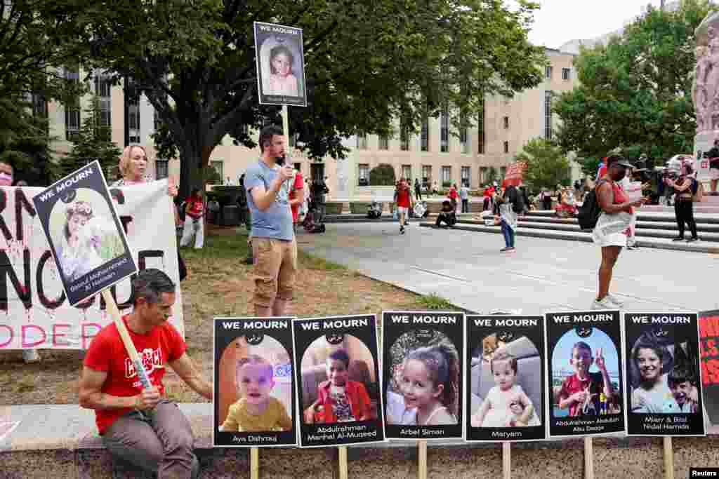 A man sits next to placards, as Pro-Palestinian demonstrators protest on the day of Netanyahu's address to a joint meeting of the U.S. Congress, on Capitol Hill in Washington, July 24, 2024.