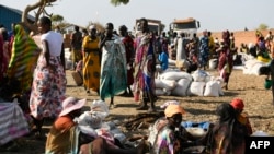 FILE - Internally displaced women wait for food rations to be distributed by the World Food Program in Bentiu, South Sudan, Feb. 6, 2023.
Persistent conflict, natural disasters, and widespread poverty have left millions of South Sudanese in urgent need of assistance.