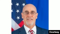 (USA) Deputy Assistant Secretary in the Bureau of African Affairs, Ambassador Robert Scott