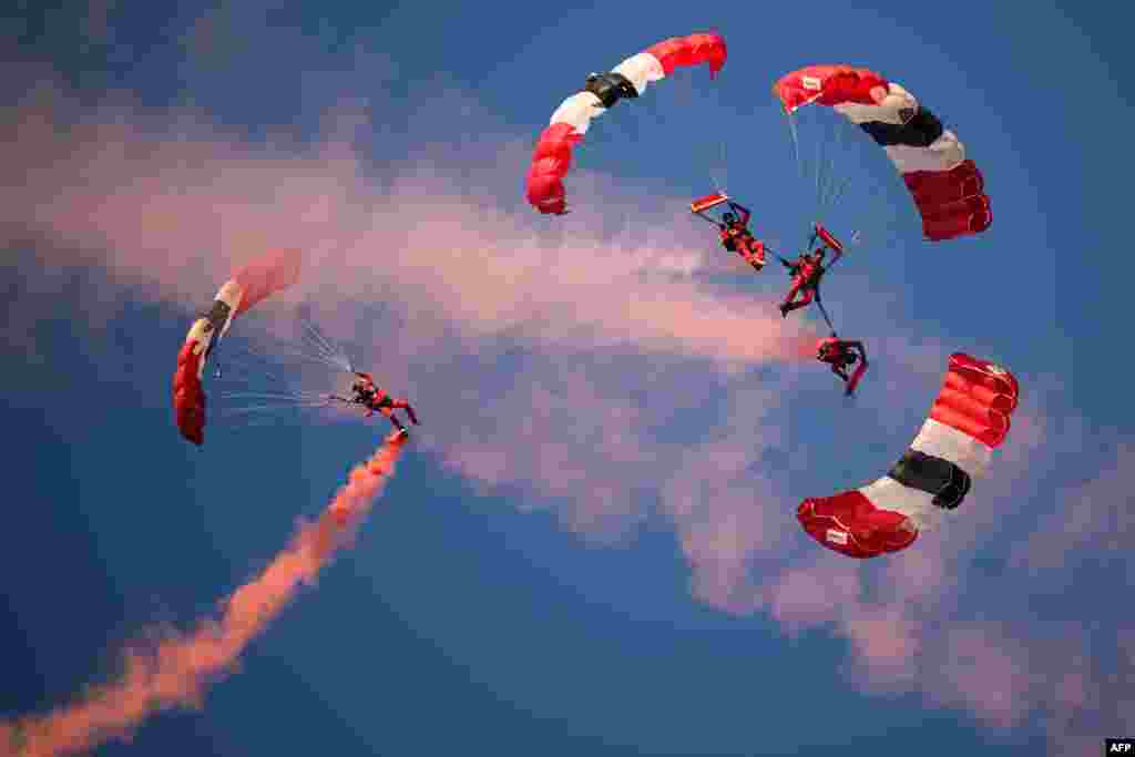Parachutists perform as they descend to Utah Beach on June 6, 2024, during the "D-Day" commemorations marking the 80th anniversary of the World War II Allied landings in Normandy. 