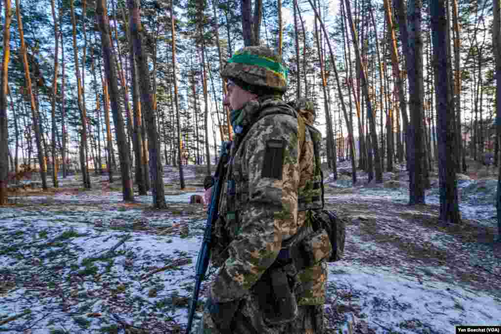 A soldier patrols the forest around Kharkiv, where the Ukrainian army created a series of defensive lines, Feb. 17, 2023.
