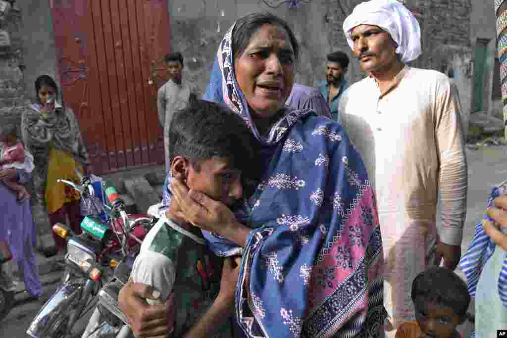 Christians weep after seeing their home vandalized by an angry Muslim mob in Pakistan on Aug. 17, 2023.