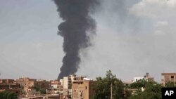 FILE - Smoke rises over Khartoum, Sudan, on June 8, 2023, as fighting between the Sudanese army and paramilitary Rapid Support Forces continued. 