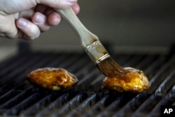 Chef Zach Tyndall prepares Good Meat's cultivated chicken at the Eat Just office in Alameda, California, June 14, 2023.