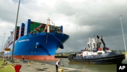 FILE - This Dec. 3, 2018, photo shows the Chinese container ship Cosco docking at the Cocoli Locks in Panama City. China’s expansion in Latin America of its Belt and Road Initiative to build trade-related facilities is stirring anxiety in Washington.