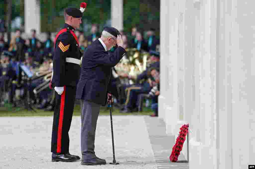 A D-Day veteran lays a wreath during the UK Ministry of Defense and the Royal British Legion's commemorative ceremony marking the 80th anniversary of the World War II "D-Day" Allied landings in Normandy, at the World War II British Normandy Memorial near the village of Ver-sur-Mer in northwestern France, June 6, 2024.