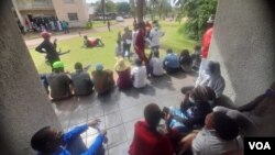 Some of the people registering to vote in the next elections. Most of them are believed to be soldiers and prison guards.