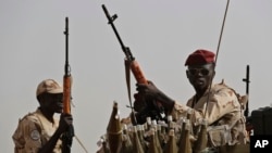 FILE - Sudanese soldiers from the Rapid Support Forces in the East Nile province, Sudan, on June 22, 2019. 