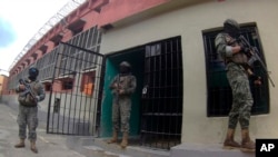 FILE - Soldiers stand guard outside Litoral Penitentiary in Guayaquil, Ecuador, Feb. 9, 2024. Late on March 30, 2024, armed gunmen attacked a group of people in the coastal city.