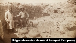 This circa 1884-1886 photo by Army surgeon/naturalist Edgar Alexander Mearns shows two unidentified men, possibly Mearns himself on right, excavating pre-Columbian ruins in central Arizona's Verde River Valley.