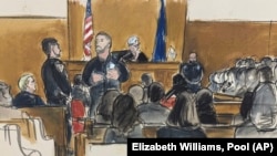 Former President Donald Trump, seated far left, looks on with Judge Juan Merchan presiding as members of the jury panel answer questions from the jury questionnaire in Manhattan criminal court in New York, April 18, 2024.