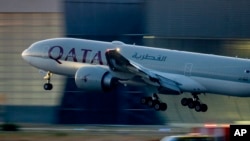 FILE - A Qatar airways plane lands at the airport in Frankfurt, Germany, as the sun rises, Sept. 25, 2023. Twelve people were injured when a Qatar Airways plane flying from Doha to Dublin, May 26, 2024 hit turbulence, airport authorities said. 