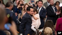 FILE - Assemblyman Anthony Rendon walks with his daughter Vienna before being sworn in as Speaker of the Assembly at the California Legislature in Sacramento, Calif., Dec. 5, 2022.