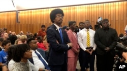 Justin Pearson enters the meeting room of the Shelby County Board of Commissioners on April 12, 2023, in Memphis, Tennessee. The commissioners voted 7-0 to reinstate Justin Pearson as a state representative.