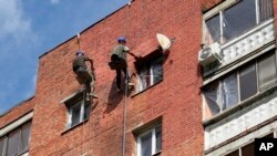 This photo released by the Governor of Russia's Kursk region Roman Starovoit's telegram channel on Aug. 28, 2023, shows a damaged apartment building after an alleged Ukrainian drone attack, in Kursk, southern Kursk region that borders Ukraine.
