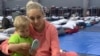 Oksana Stakhnevych, a Ukrainian refugee, and her son at a temporary shelter in 2022 where she stayed while on the Mexican-U.S. border. Courtesy of Oksana Stakhnevych. 