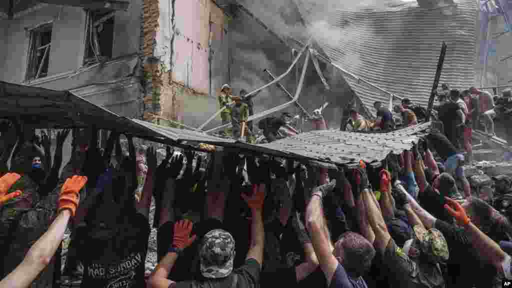 Emergency services personnel work at the site of Okhmatdyt children’s hospital hit by Russian missiles, in Kyiv, Ukraine, July 8, 2024.