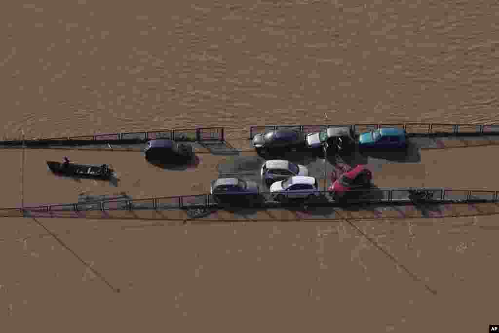 Cars sit on a submerged road in an area flooded by heavy rain in Porto Alegre, Rio Grande do Sul state, Brazil.