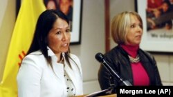 FILE - Lynn Trujillo, left, speaks at a news conference in Santa Fe, N.M., on Jan. 22, 2019. Trujillo has been tapped to serve as a top legal advisor to U.S. Interior Secretary Deb Haaland.