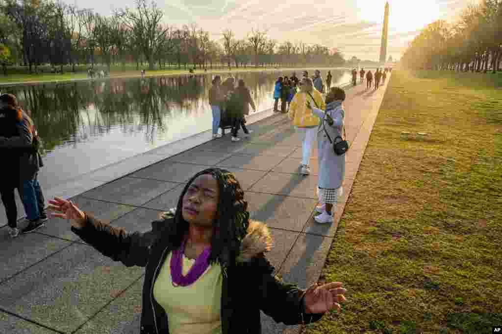 Worshipers listen to a sermon by Mark Batterson, lead pastor of National Community Church, during a sunrise Easter service at the Lincoln Memorial in Washington.