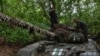 Ukrainian servicemen of the 65th brigade prepare their tank for the next operation to defend their positions at the frontline in Zaporizhzhia region, Ukraine, April 18, 2024. 