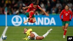 Morocco's Hanane Ait El Haj (R) watches as Colombia's Manuela Vanegas, down, challenges Morocco's Sakina Ouzraoui during the Women's World Cup Group H soccer match between Morocco and Colombia in Perth, Australia, Aug. 3, 2023. 