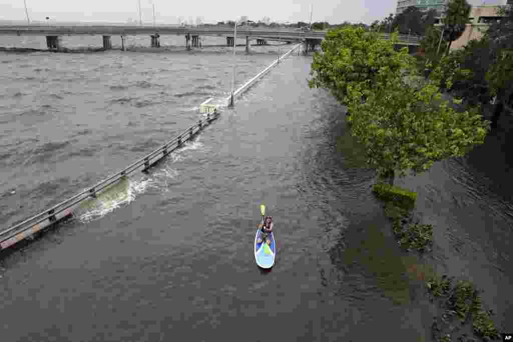 Flood waters from Hurricane Idalia inundate a sea wall along Old Tampa Bay in Tampa, Florida.