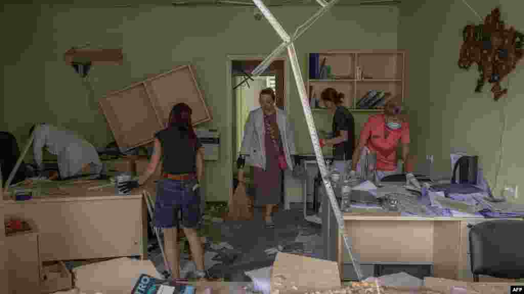 Medical personnel clear the rubble inside a heavily damaged building of Okhmatdyt children's hospital following a Russian missile attack in the Ukrainian capital of Kyiv, July 8, 2024.
