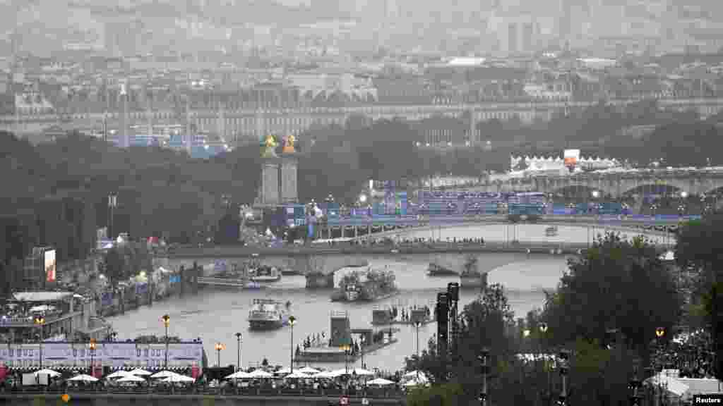 Boats filled with athletes head down the Seine as part of the opening ceremony of the opening ceremony of the Paris 2024 Olympic Games, July 26, 2024.