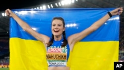 FILE - Yaroslava Mahuchikh of Ukraine smiles after winning the gold medal in the women's high jump final at the European Athletics Championships in Rome on June 9, 2024.