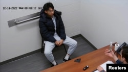 Xiaolei Wu, a Chinese citizen and student at the Berklee College of Music in Boston, sits for an interview with the FBI at its office in Chelsea, Mass., Dec. 14, 2022. (U.S. Attorney’s Office for the District of Massachusetts/Handout via Reuters)