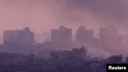 Buildings lie in ruin in Gaza, amid the ongoing conflict between Israel and the Palestinian group Hamas, as seen from south Israel.