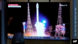 A TV screen shows a report of North Korea's spy satellite into orbit with its third launch attempt this year, during a news program at the Seoul Railway Station in Seoul, South Korea, Nov. 22, 2023.