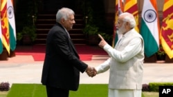 Indian Prime Minister Narendra Modi welcomes Sri Lankan President Ranil Wickremesinghe before their meeting in New Delhi, July 21, 2023.