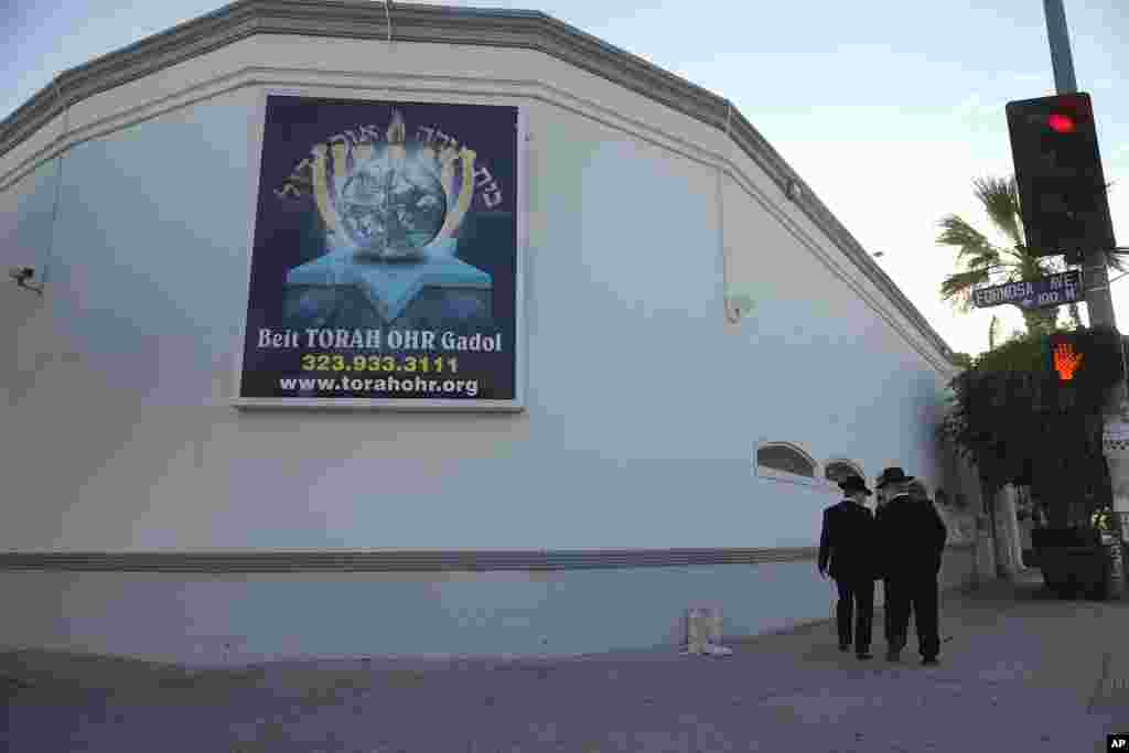 Men walk outside the Torah Ohr synagogue in Los Angeles on Oct. 7, 2023.