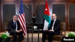 US Secretary of State Antony Blinken meets with Jordanian Foreign Minister Ayman Safadi, during Blinken's week-long trip aimed at calming tensions across the Middle East, in Amman, Jordan, Jan. 7, 2024. 