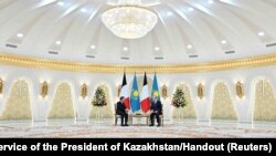 Kazakh President Kassym-Jomart Tokayev, right, and French President Emmanuel Macron attend a meeting in Astana, Kazakhstan, Nov. 1, 2023.