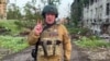 FILE - This video grab taken from handout footage posted May 25, 2023, on the Telegram account of the press service of Concord - a company linked to Russian mercenary Wagner group, shows Yevgeny Prigozhin speaking from Bakhmut. 