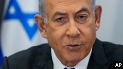 FILE - Israeli Prime Minister Benjamin Netanyahu chairs a Cabinet meeting at the Kirya military base, which houses the Israeli Ministry of Defense, in Tel Aviv, Israel, on Dec. 24, 2023.