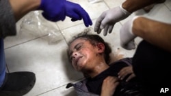 A Palestinian child wounded during the Israeli bombardment of the Gaza Strip receives treatment at the Nasser hospital in Khan Younis, Southern Gaza Strip, Jan. 6, 2024.