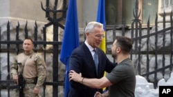 NATO Secretary General Jens Stoltenberg, left, and Ukrainian President Volodymyr Zelenskyy shake hands prior to their meeting in Kyiv, Ukraine, Sept. 28, 2023.