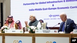 
Prince wa Saudi Arabia Mohammed bin Salman Al Saud, kushoto, Waziri Mkuu wa India Narendra Modi, katikati , na Rais wa Marekani Joe Biden wakihudhuria kikao cha Ushirikiano wa Kimataifa wa Miundombinu na Uwekezaji wakati wa Mkutano wa G20 New Delhi, India, Sept. 9, 2023. 