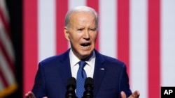 President Joe Biden speaks about democracy and the legacy of Arizona Republican Sen. John McCain at the Tempe Center for the Arts, Sept. 28, 2023, in Tempe, Ariz. 