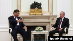 Russian President Vladimir Putin and Chinese President Xi Jinping attend a meeting at the Kremlin in Moscow, Russia, March 20, 2023.