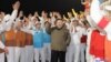 Pemimpin Korea Utara Kim Jong Un merayakan keberhasilan peluncuran roket yang membawa satelit mata-mata Malligyong-1 di Provinsi Gyeongsang Utara, Korea Utara, 21 November 2023. (Foto: KCNA via REUTERS)