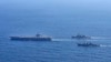 In this photo provided by the South Korean Joint Chiefs of Staff, the USS Carl Vinson, left, sails with South Korean Navy's Aegis destroyer King Sejong the Great, and Japan's Maritime Self-Defense Force Aegis destroyer Kongou during a 2024 joint drill.