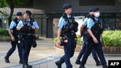 FILE - Police patrol at Victoria Park in Hong Kong, June 2, 2023.