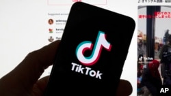 FILE - The TikTok logo is seen on a mobile phone in front of a computer displaying the TikTok home screen, in Boston, Mass., March 18, 2023.