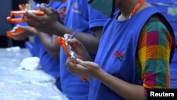 An undated handout photo of workers at the Aequs toy manufacturing facility in Belgaum, India. Aequs makes dozens of types of toys for Hasbro and other companies in two 350,000-square-foot facilities in Belgaum.