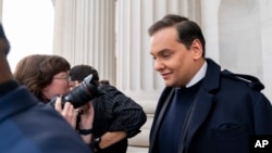 Rep. George Santos, R-N.Y., leaves the Capitol after being expelled from the House of Representatives, Friday, Dec. 1, 2023, in Washington. (AP Photo/Stephanie Scarbrough)
